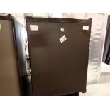 Polar CE322 black mini drinks fridge. This lot is offered for sale on behalf The Brabners Charity