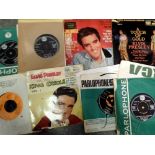 Twelve Elvis Presley singles. UK P&P Group 2 (£20+VAT for the first lot and £4+VAT for subsequent