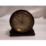 Miniature mahogany clock, working at lotting up. UK P&P Group 1 (£16+VAT for the first lot and £2+