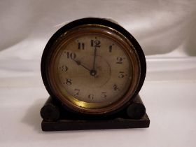 Miniature mahogany clock, working at lotting up. UK P&P Group 1 (£16+VAT for the first lot and £2+