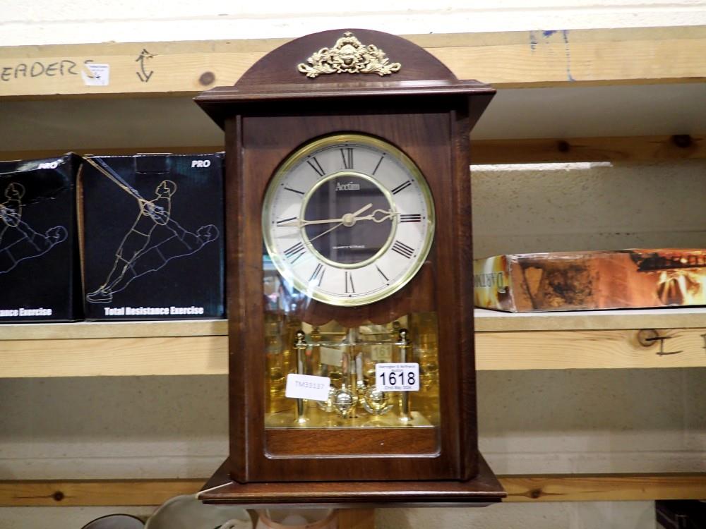 Small Actium quartz strike battery powered wall clock. Not available for in-house P&P