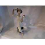 Lladro figurine of a girl brushing her hair, H: 22 cm. UK P&P Group 2 (£20+VAT for the first lot and