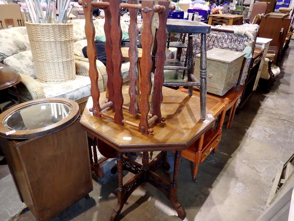 Octagonal crossbanded occasional table and two stools and a wine rack. Not available for in-house