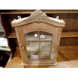 Solid oak wall cupboard of small proportions with six glazed door panels and brass door furniture,