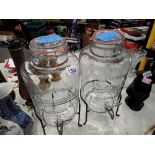 Two Nantucket two gallon punch barrels on metal stands. This lot is offered for sale on behalf The