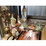 Shelf of mixed religious artifacts to include Lourdes. Not available for in-house P&P