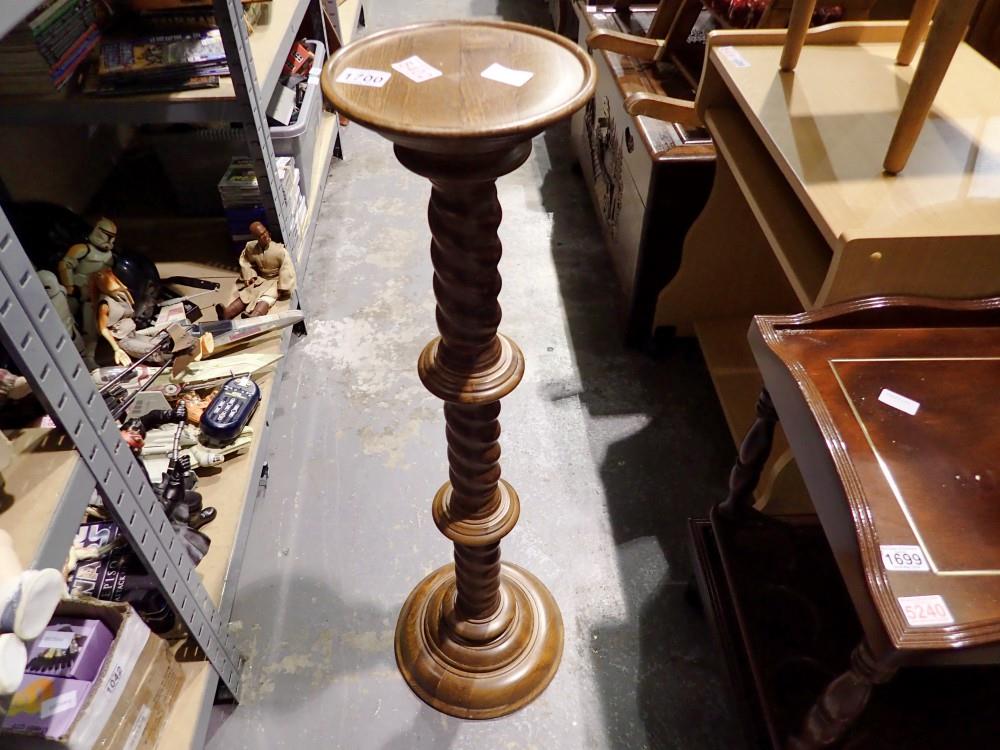 Large carved wooden lamp and a wooden plant stand with barleytwist stem. Not available for in-