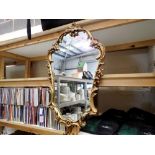 Gilt framed shaped mirror, H: 66 cm, L: 37 cm. Not available for in-house P&P