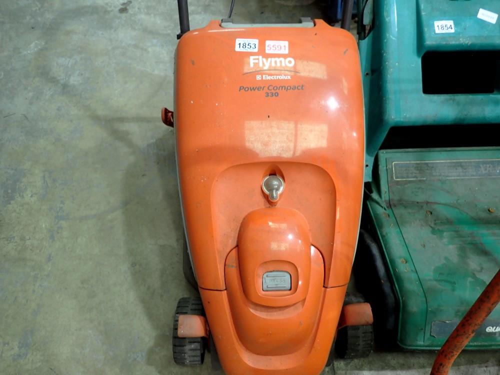 Flymo Power Compact 330 lawnmower. Powers up and spins blades, power button sticks. All electrical