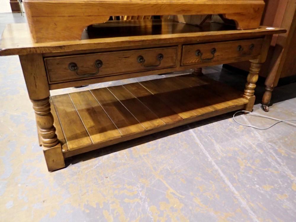 Substantial oak coffee table with two drawers and under tier, 122 x 60 x 50 cm H. Not available