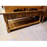 Substantial oak coffee table with two drawers and under tier, 122 x 60 x 50 cm H. Not available