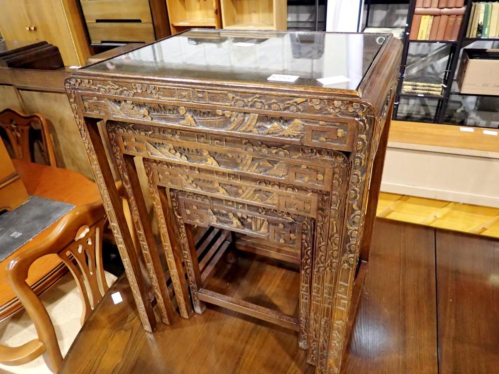 Nest of four Chinese carved hardwood tables. Not available for in-house P&P