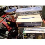 Portable DVD player, two karaoke machines, head phones and Wii games discs. Not available for in-