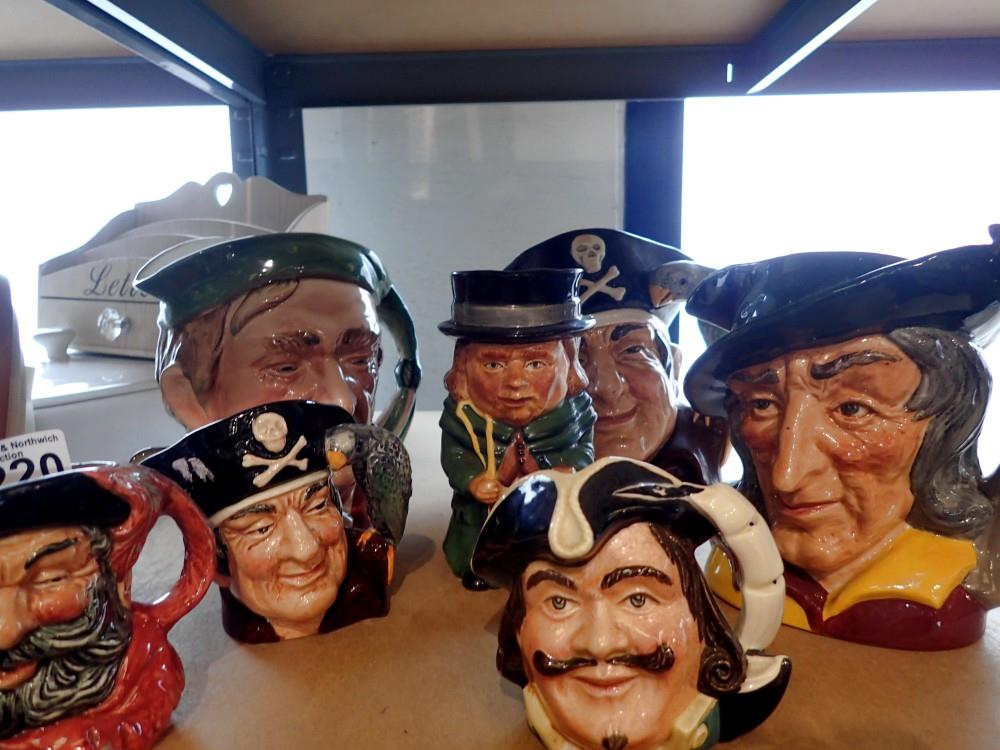 Seven ceramic character jugs to include Long John Silver, largest H: 16 cm. Not available for in-