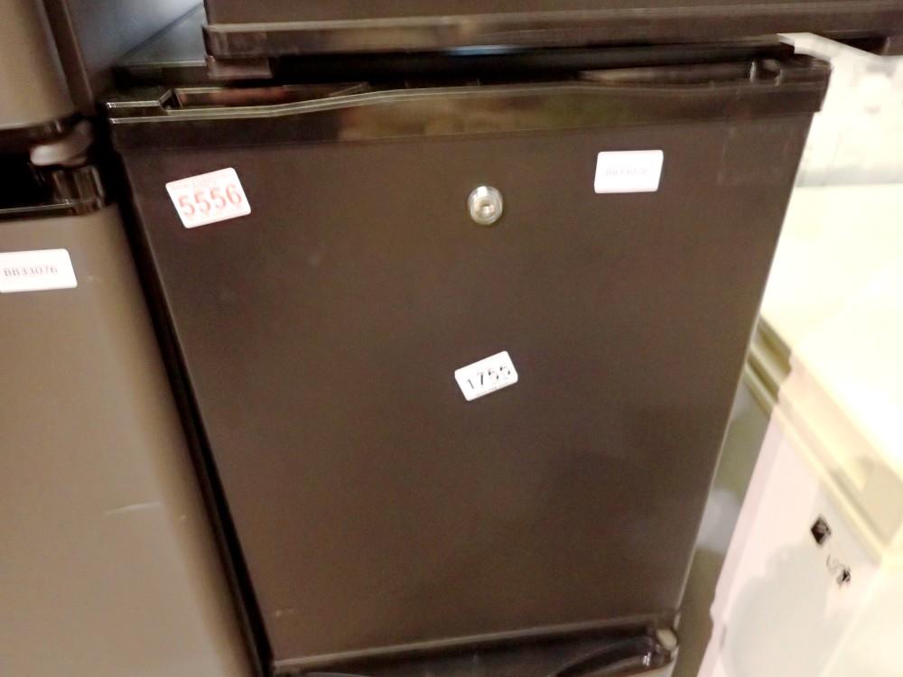 Polar CE322 black mini drinks fridge. This lot is offered for sale on behalf The Brabners Charity