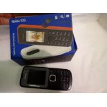 Boked Nokia 108 phone with charger and headphones. UK P&P Group 1 (£16+VAT for the first lot and £