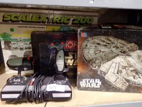 Three boxed games to include a 3D Star Wars puzzle and a Quickshot driving joystick. Not available