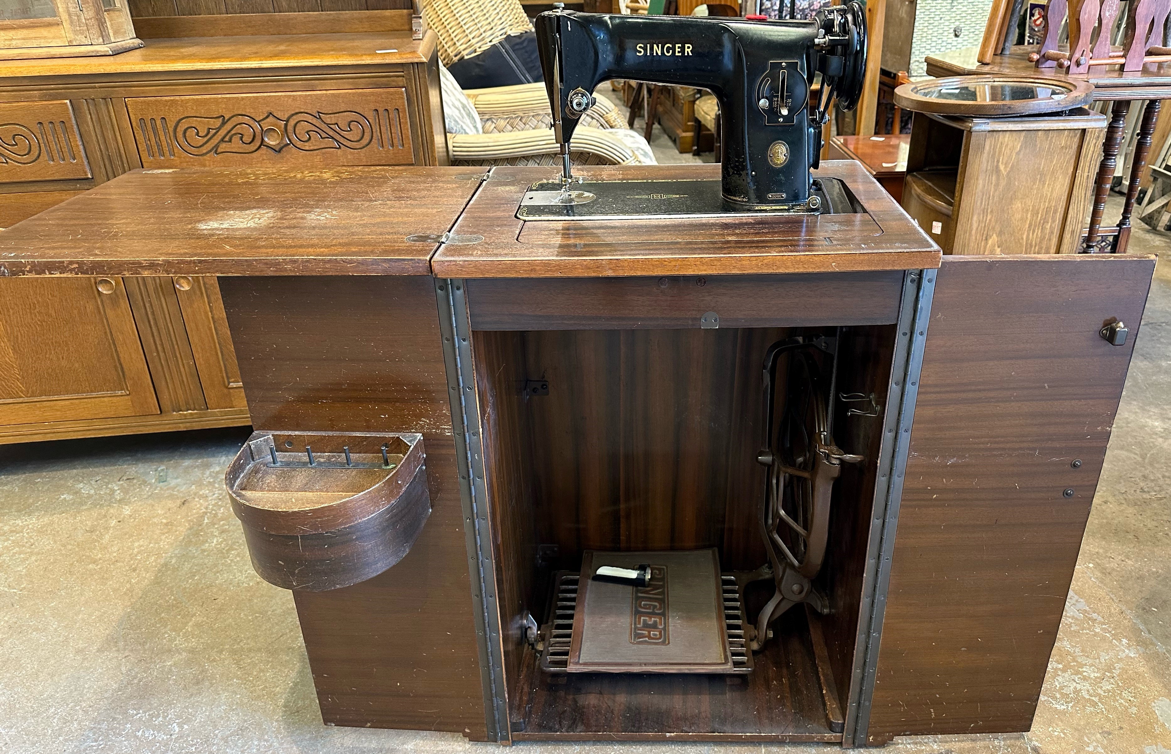 Electric Singer sewing machine in mahogany case. Not available for in-house P&P