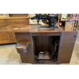 Electric Singer sewing machine in mahogany case. Not available for in-house P&P