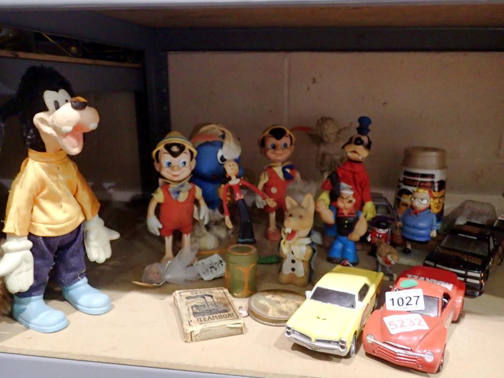 Shelf of classic Disney toys to include Pinocchio, Popeye and others. Not available for in-house P&P