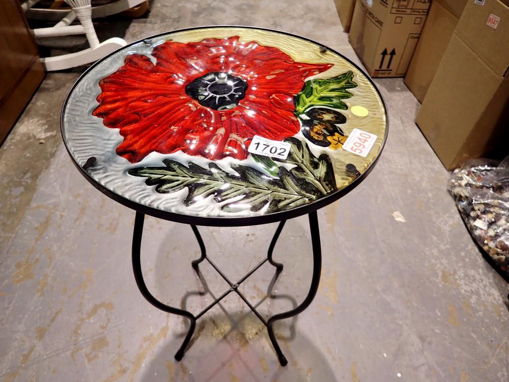Small garden/conservatory table with metal base and poppy top. Not available for in-house P&P