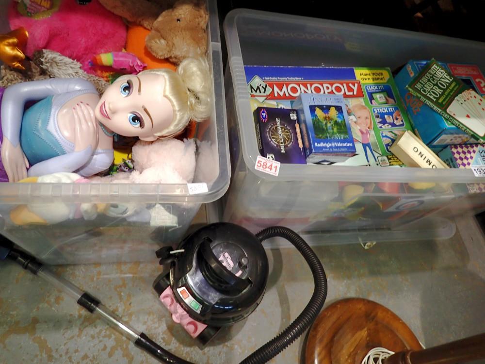 Two plastic containers of puzzles and games, also including a Hetty Hoover and soft toys. Not