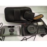 Pentax zoom 70 camera and Canon sure shot sleek camera. UK P&P Group 1 (£16+VAT for the first lot