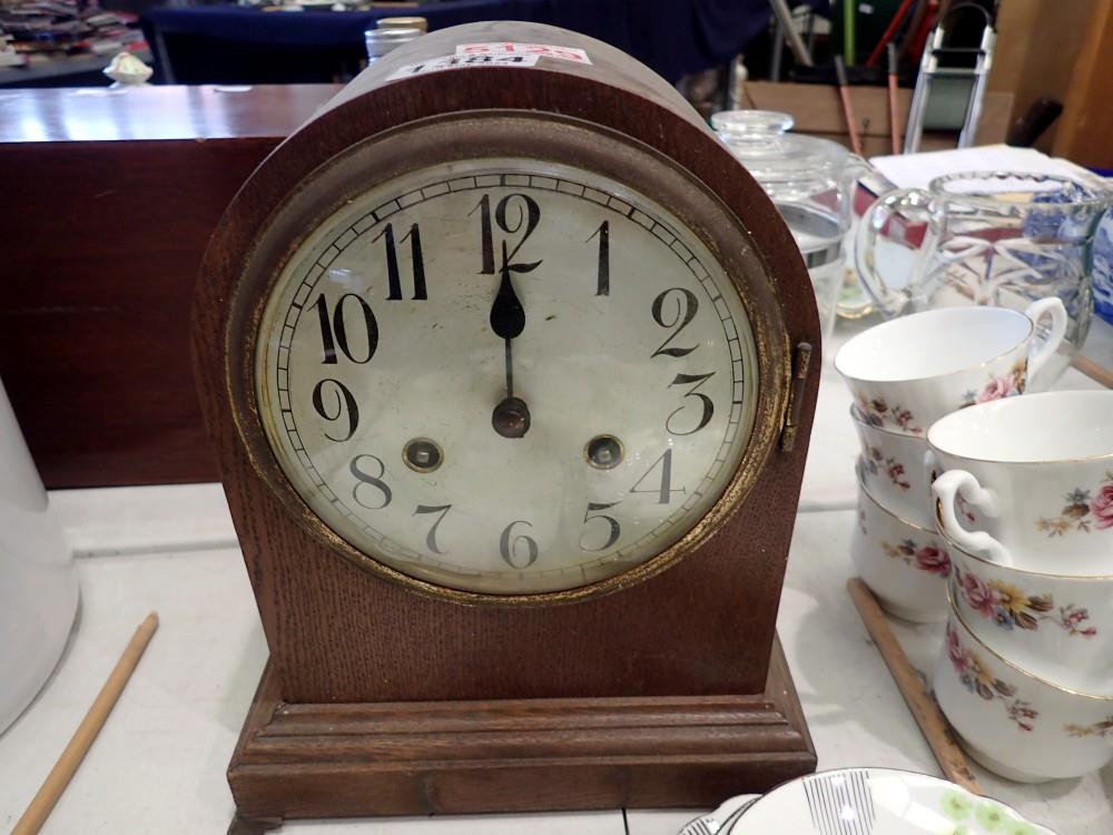 Oak domed chiming mantel clock, with key and pendulum. Not available for in-house P&P