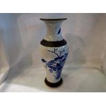 Oriental vase with signature. Wear to base, vertical large hairline crack, many firing pit marks. UK