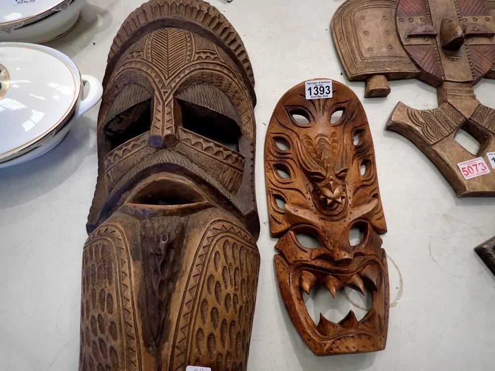 Two carved wooden Tribal masks. Not available for in-house P&P