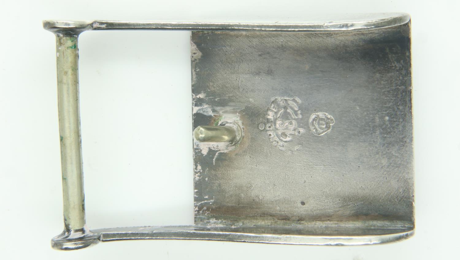 A white metal buckle, decorated in relief with an image of Aries, stamped verso (indistinct). UK P&P - Image 2 of 2