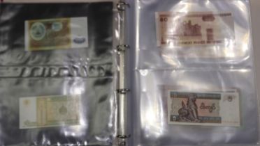 Folder of world banknotes, mostly uncirculated. UK P&P Group 1 (£16+VAT for the first lot and £2+VAT