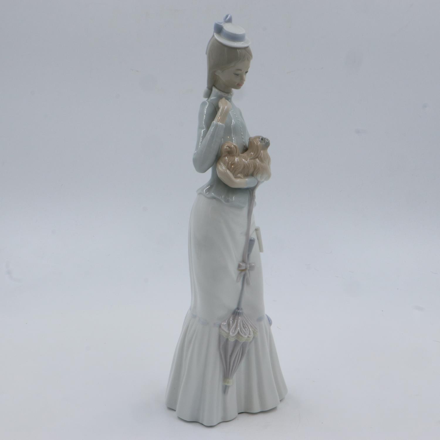Lladro figurine of a girl with a dog, H: 37 cm, no cracks or chips. UK P&P Group 2 (£20+VAT for