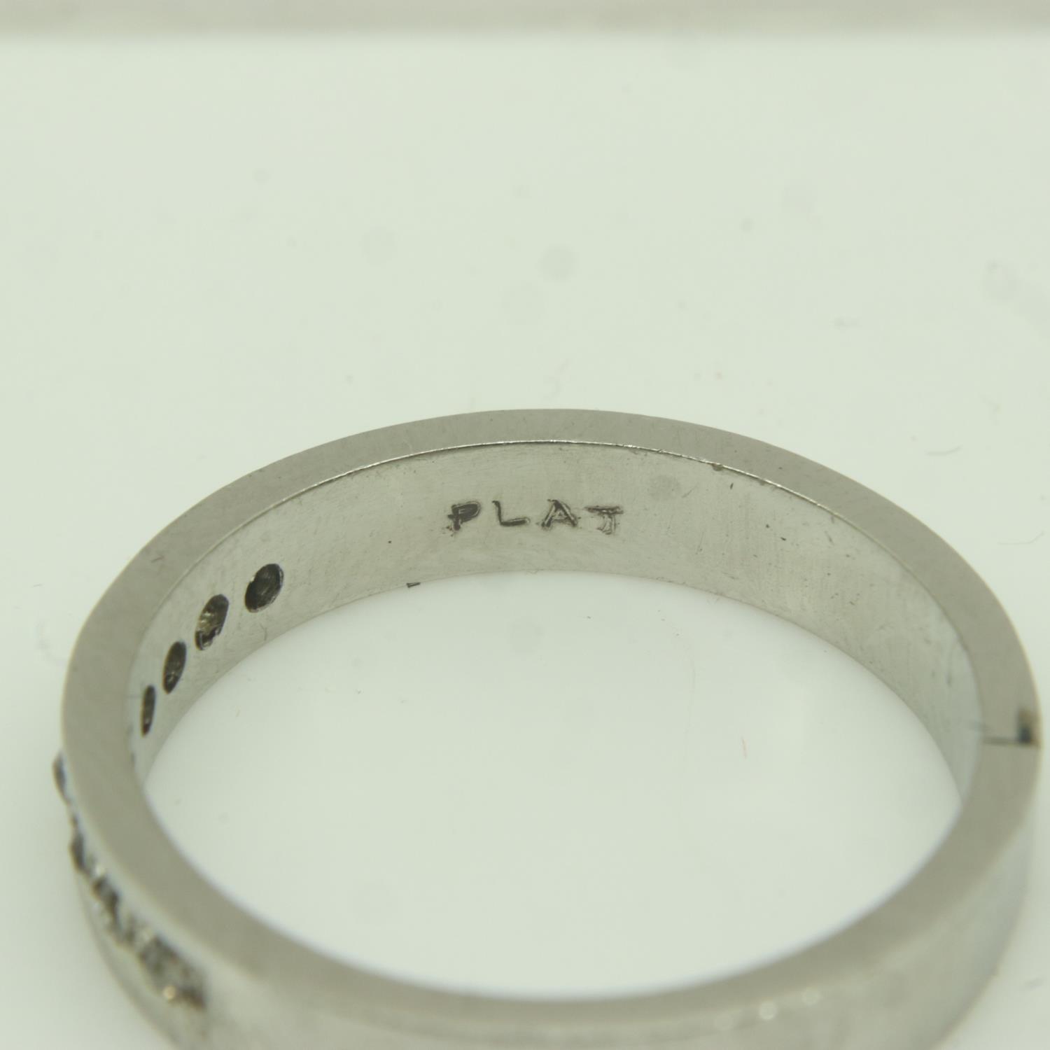 Contemporary platinum band ring, channel-set with eight diamonds, size M/N, 5.4g. UK P&P Group 0 (£ - Image 3 of 3