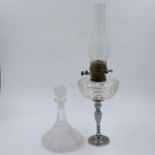 Paraffin lamp with a glass reservoir and a ships decanter, lamp H: 60 cm, no chips or cracks. Not