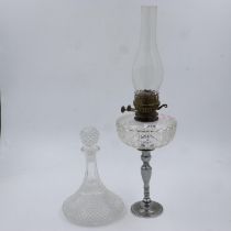 Paraffin lamp with a glass reservoir and a ships decanter, lamp H: 60 cm, no chips or cracks. Not