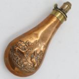 Brass relief decorated powder flask, L: 21 cm. UK P&P Group 2 (£20+VAT for the first lot and £4+