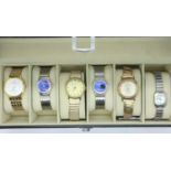 Six fashion wristwatches in a six-section display box. UK P&P Group 1 (£16+VAT for the first lot and