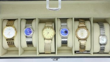 Six fashion wristwatches in a six-section display box. UK P&P Group 1 (£16+VAT for the first lot and