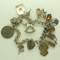 925 silver charm bracelet with thirteen charms, L: 22 cm, 33g. UK P&P Group 0 (£6+VAT for the