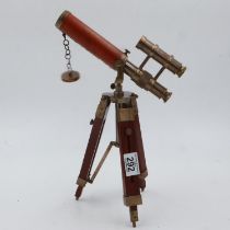 Brass and leather telescope on wooden stand, H: 36 cm. UK P&P Group 2 (£20+VAT for the first lot and