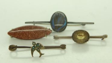Four bar brooches, set with goldstone, pearls, butterfly-wing and citrine, largest L: 50 mm. P&P