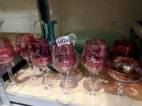 Collection of mixed coloured drinking glass to include jug and wine glasses. Not available for in-