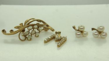 A pair of 9ct gold stud earrings, each set with three pearls in the form of three-leaf clovers,