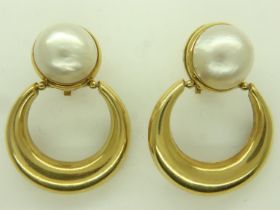 A pair of 18ct gold crescent earrings, each set with a large domed circular baroque pearl, drop L: