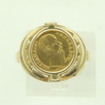 A 14ct gold ring, set with a 22ct gold Mexican traditional wedding token dated 1865, shank mis-