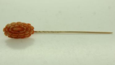 9ct gold stick pin, mounted with a large panel of carved coral, L: 70 mm, 2.8g. UK P&P Group 0 (£6+