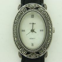 LE CHAT: ladies silver cased wristwatch, with pearlescent oval dial, requires battery. UK P&P