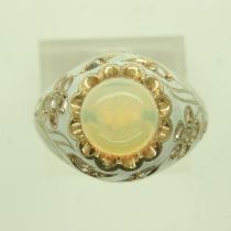 18ct gold enamelled ring, set with rose cut diamonds and a large cabochon opal, size N, unmarked,