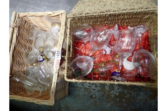 Two wicker hampers containing assorted glassware and a hand painted cruet set. Not available for